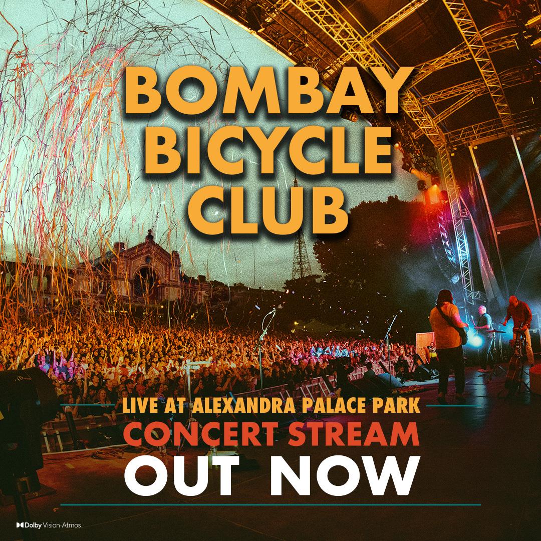 A live concert by Bombay Bicycle Club is being streamed from Alexandra Palace Park. The stage is lit with colorful lights and confetti is in the air. An audience watches the performance.