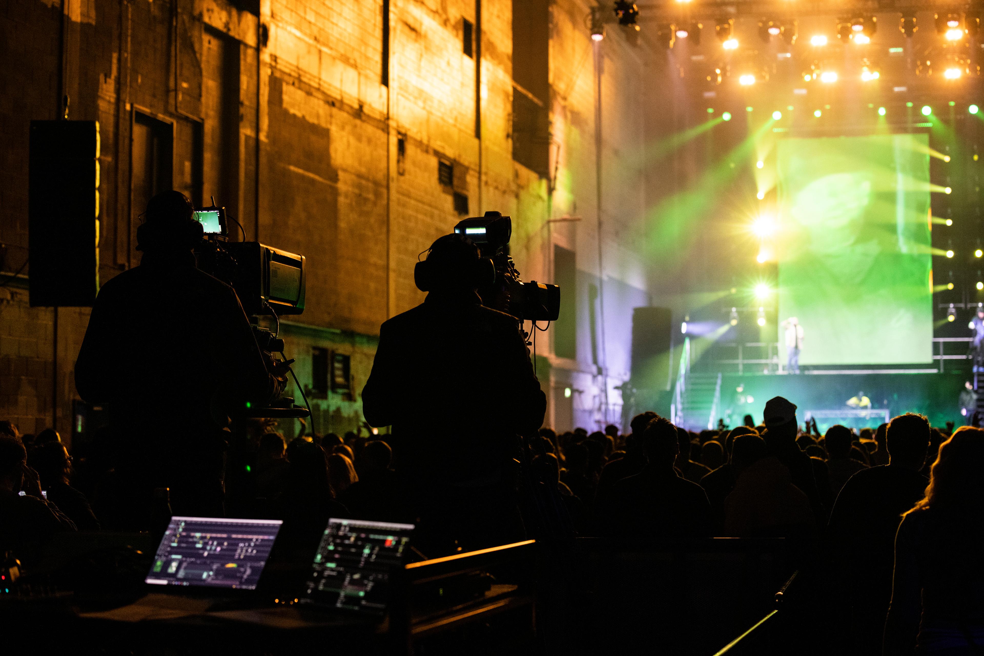 Kurupt FM live on stage at Printworks London shot from behind the broadcast  cameras