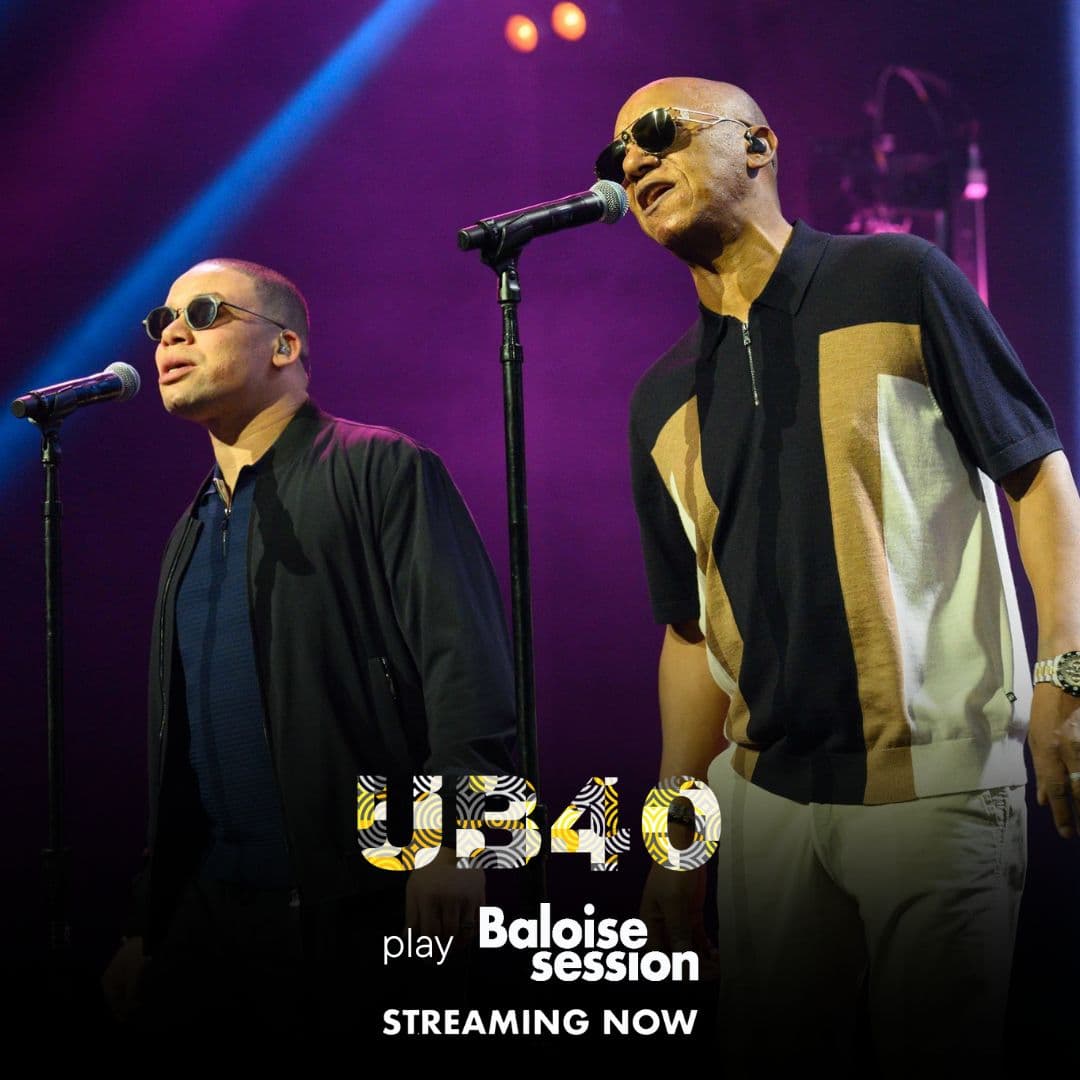 Two men sing into microphones on stage under colorful lights. Text reads: "UB40 play Baloise Session. Streaming now.