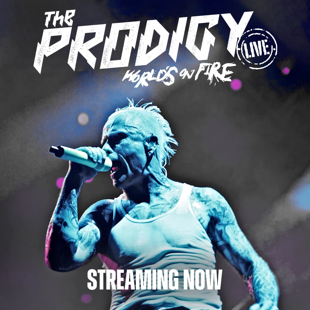 The Prodigy frontman with tattoos and a mohawk sings into a microphone. Text: "The Prodigy (Live) World's on Fire - Streaming Now.