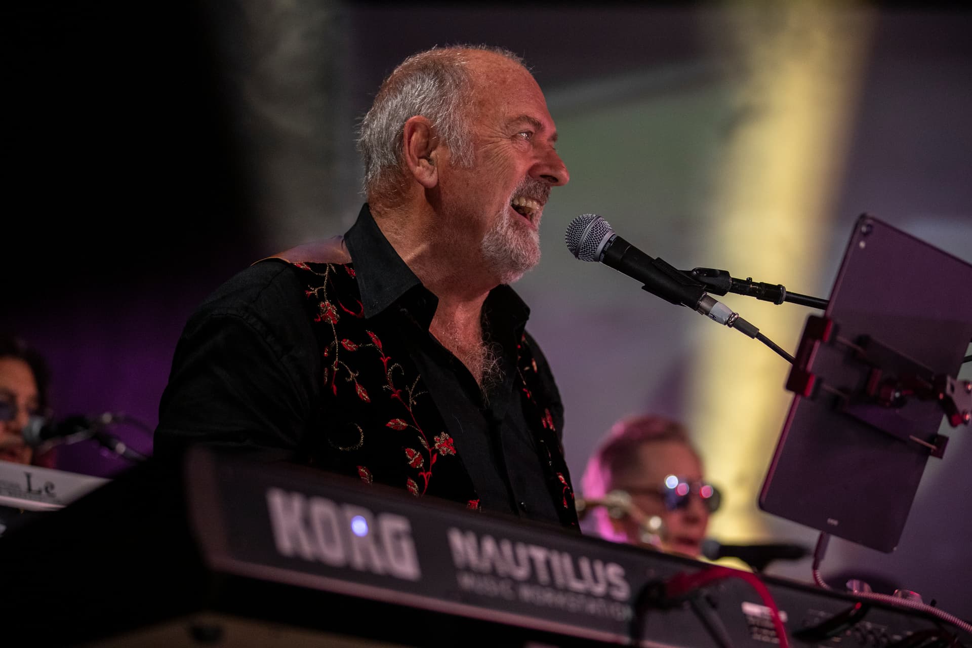 SAS band member spike edney playing keyboards on stage