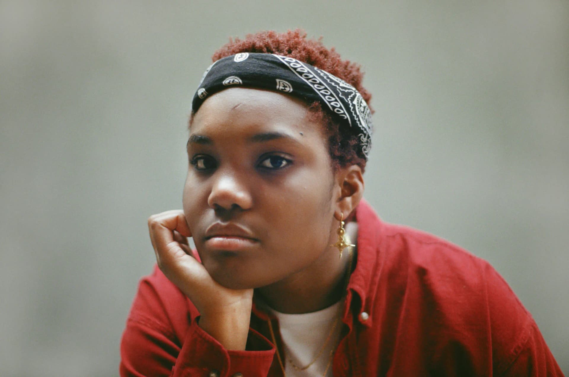 Arlo Parks press photo wearing a bandana
