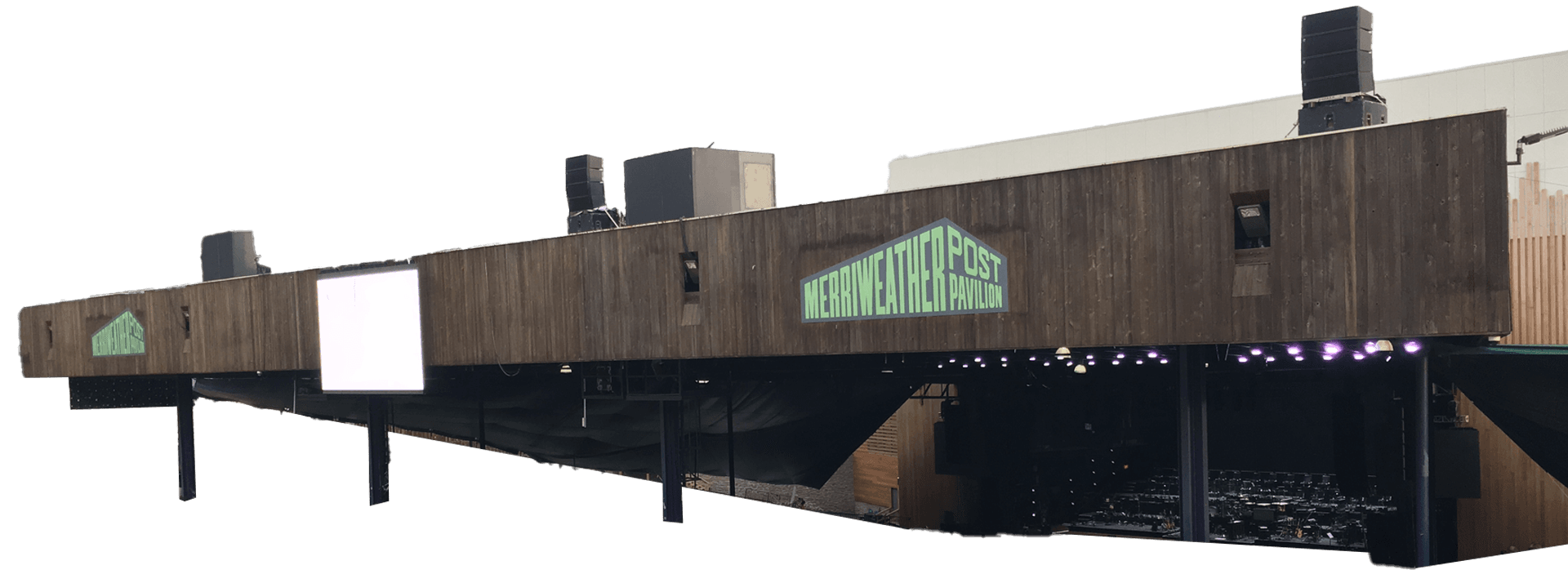 A large outdoor concert pavilion with a wooden exterior labeled "Merriweather Post Pavilion." People are gathering in front of the stage. Trees surround the venue.