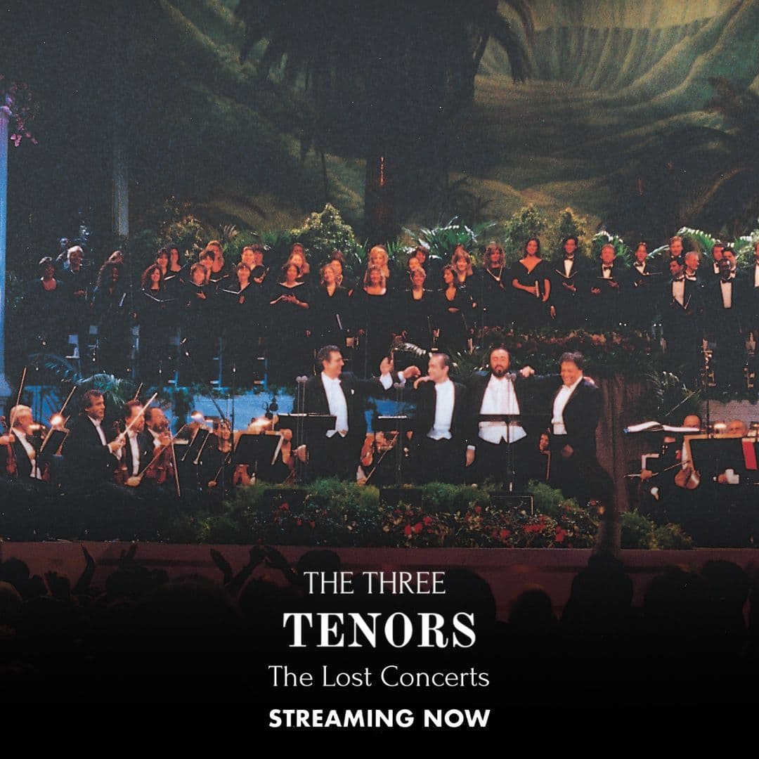 The Three Tenors perform on stage with an orchestra and choir behind them under dramatic stage lighting; text reads "The Three Tenors: The Lost Concerts, Streaming Now.