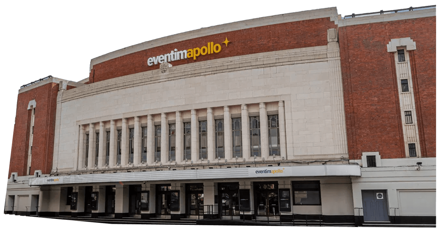 Exterior view of the Eventim Apollo venue, a historic art deco building with a cream facade and red brick accents, featuring a prominent sign with its name.