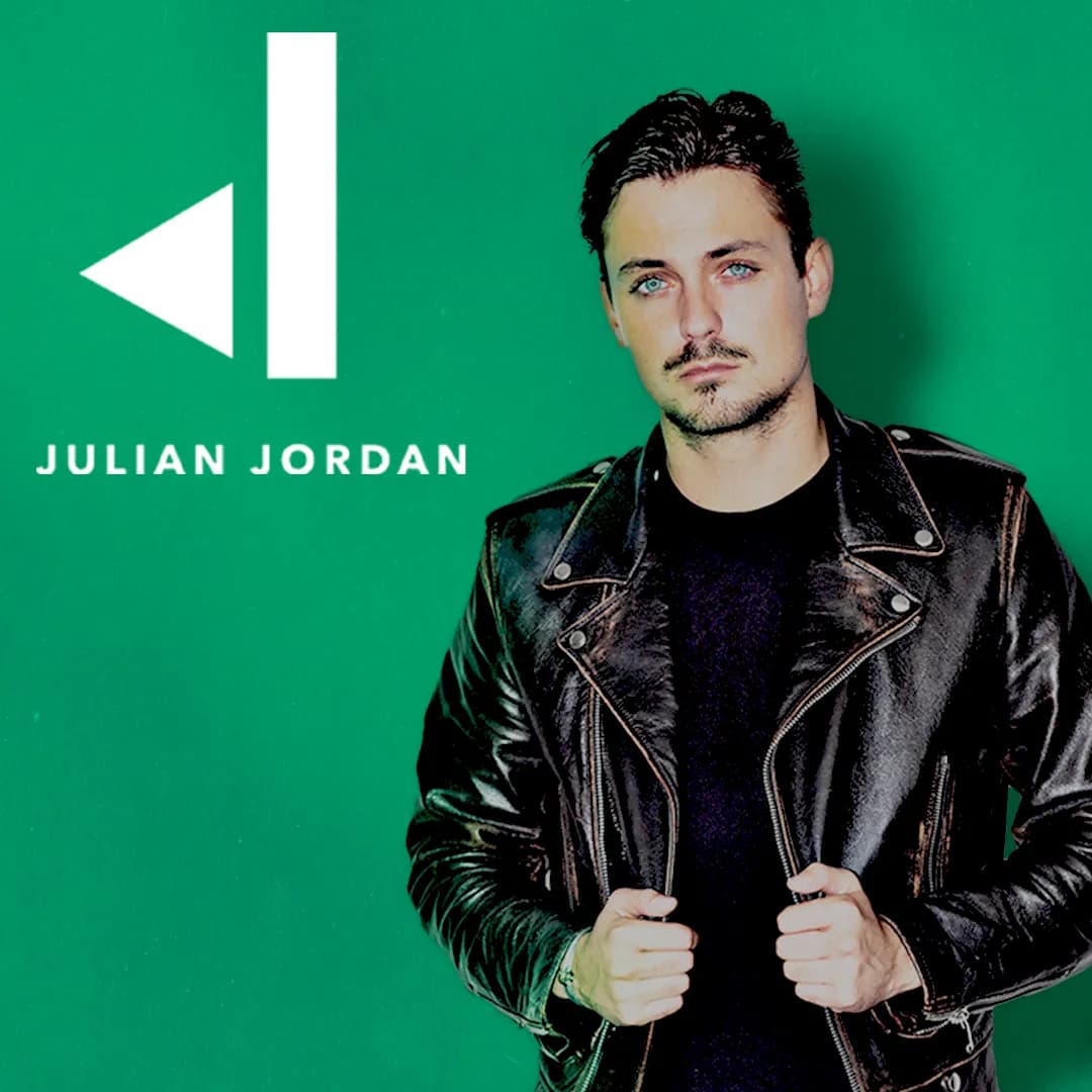 Julian Jordan in a black leather jacket stands against a green background with white text and a logo that says "JULIAN JORDAN.