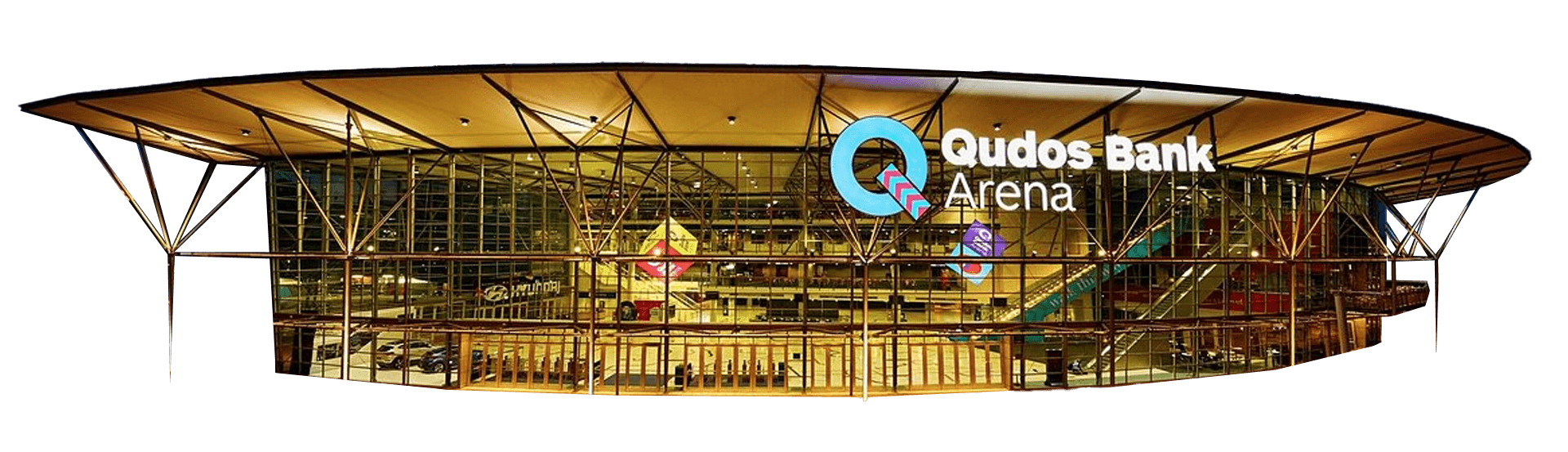Exterior view of Qudos Bank Arena at dusk, featuring large glass walls and illuminated signage displaying the arena’s name.