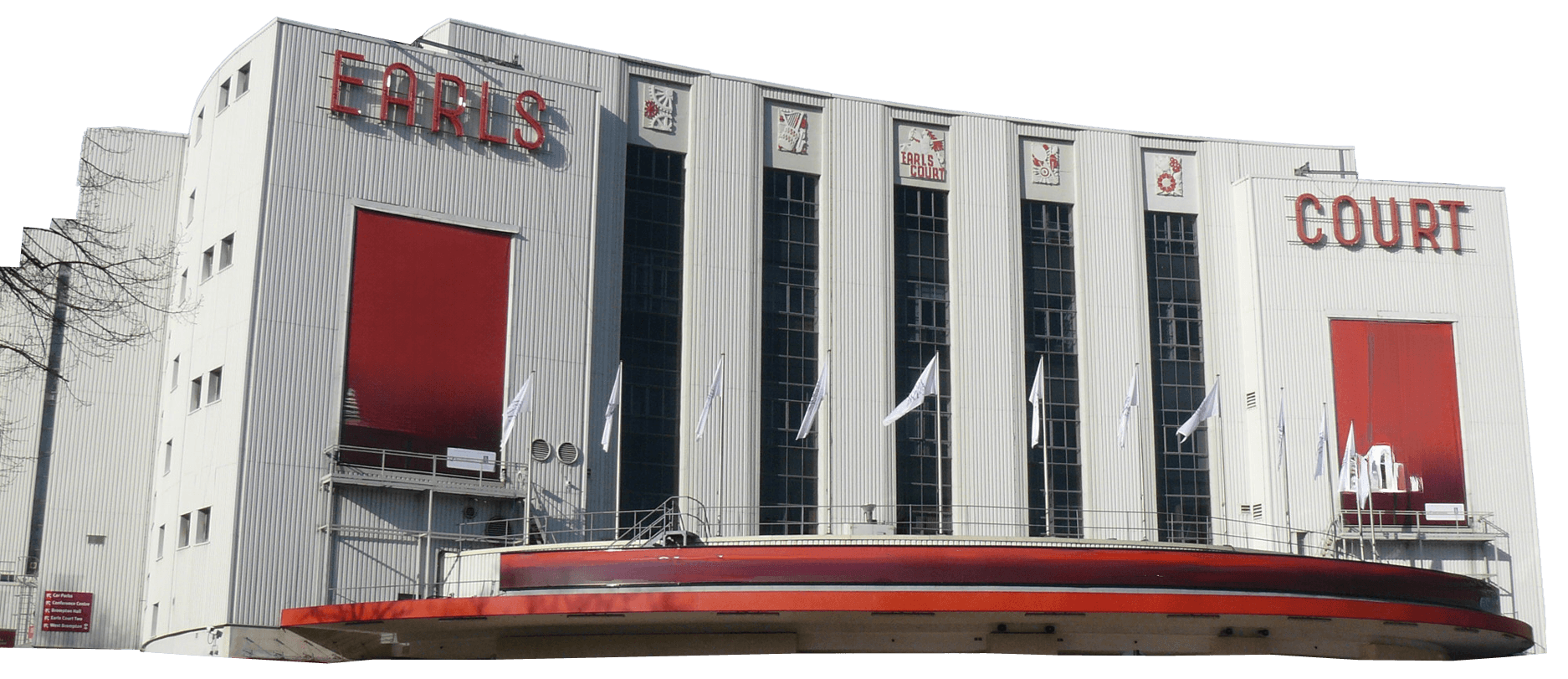 White Art Deco building with large vertical windows and red signage reading "EARLS COURT"; several white flags are displayed at the entrance.