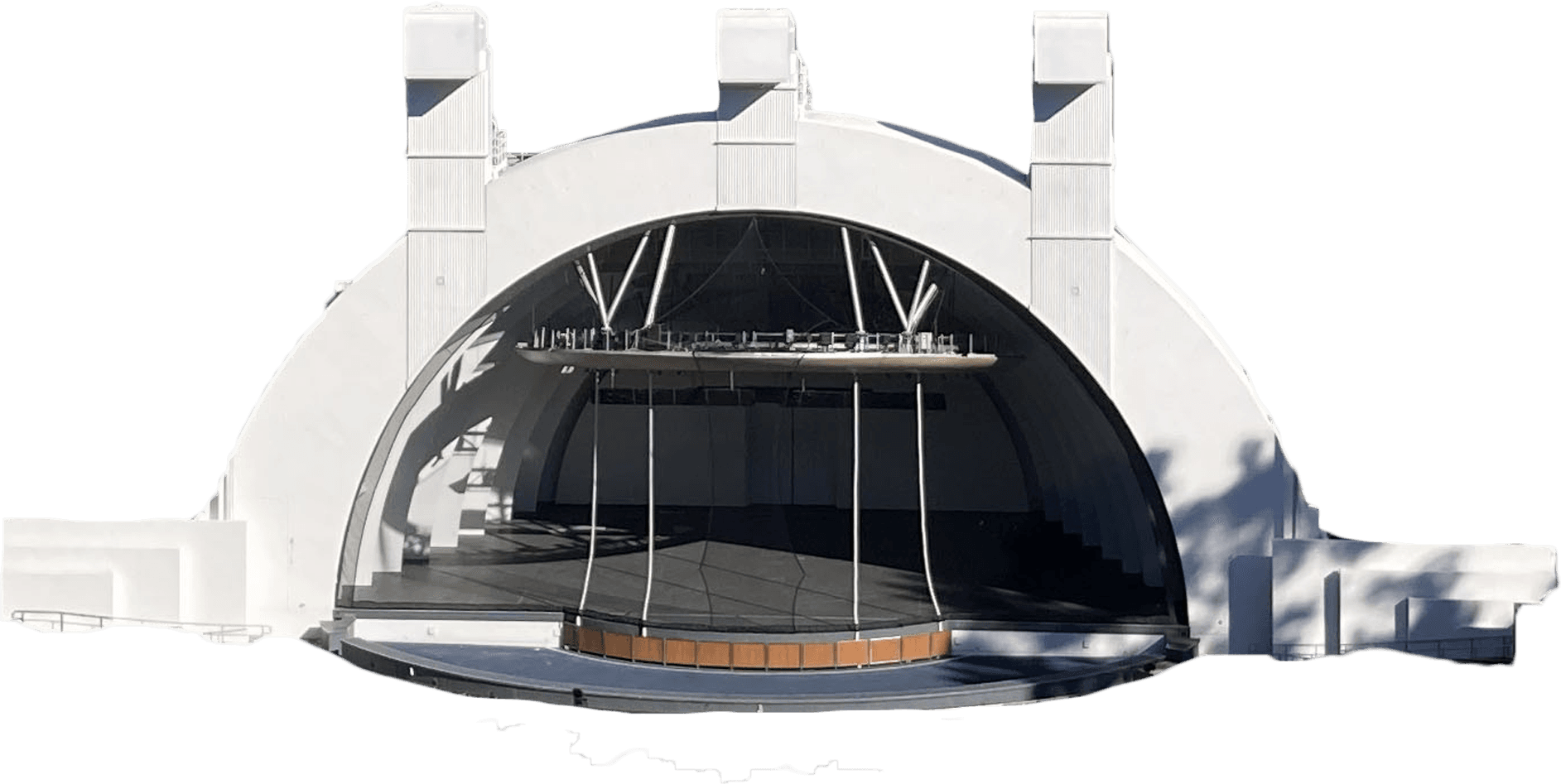 Hollywood Bowl with a distinctive arch design and tiered seating, surrounded by trees and hills.