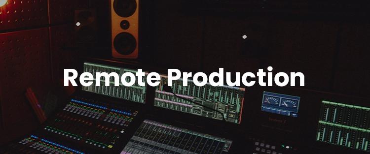 A dimly lit music production studio with various audio mixing equipment and a label reading "remote production" at the center.