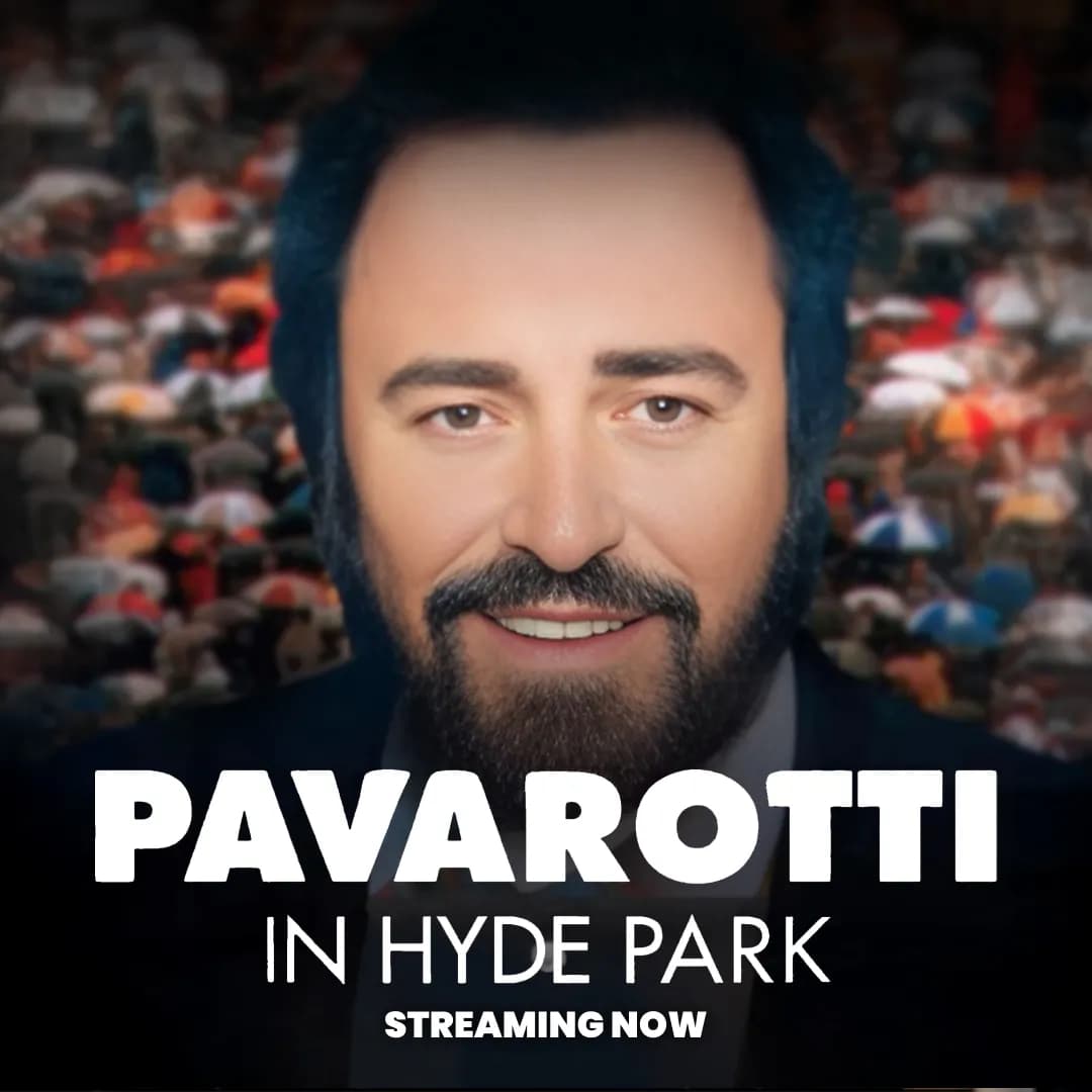 Close-up illustration of Pacarotti with a beard, dark hair, and a suit, against a blurred background of a crowd. Text reads: "Pavarotti in Hyde Park. Streaming Now.